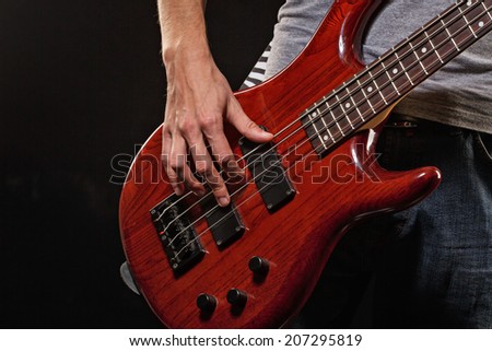 Guitarist playing blues photographed close-up hands and guitar, man is not recognizable