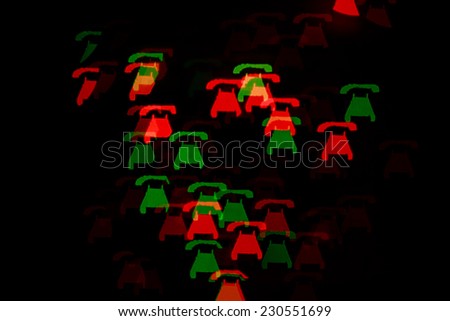Multicolored abstract background of lights in the form of the phone is not in focus