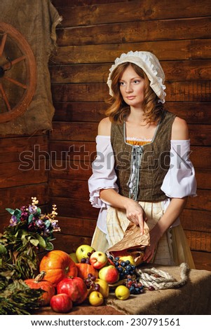 Peasant Woman cook a festive meal to the day of harvest. Retro stylized image.