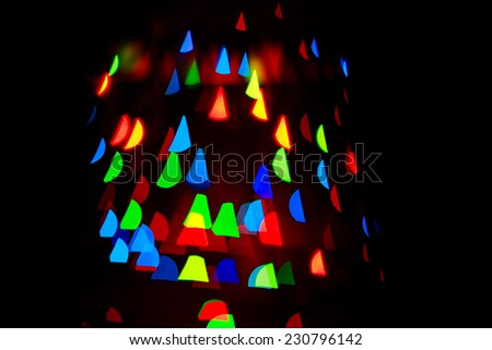 Multicolored abstract background of lights in the shape of triangles not in focus