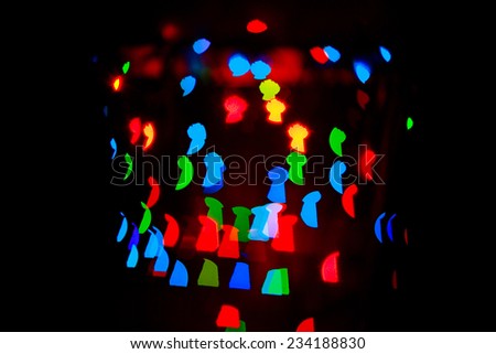 Multicolored abstract background of lights in the form of a keyhole is not in focus