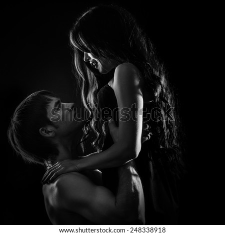 Young couple in love hugging each other, black and white photo