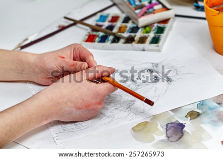 The artist paints a picture to pencil sketches. Art background