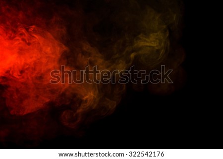 Abstract art. Colorful red and yellow smoke hookah on a black background. Background for Halloween. Texture fog. Design element. The concept of toxic substances.