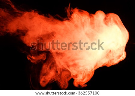 Abstract art. Red smoke hookah on a black background. Inhalation. The steam generator. The concept of poison gas. Gas.