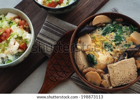 Frozen Tofu Soup Frozen tofu braised with fish flesh and mushrooms, and topped with beaten eggs and greens.