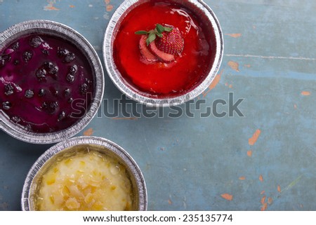 Orange Strawberry and Blueberry Pie on Vintage Background