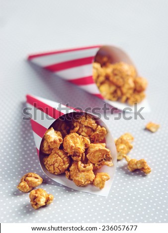sweet and salted caramel popcorn with striped pattern plate