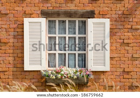 sweet vintage window with flower and grass.