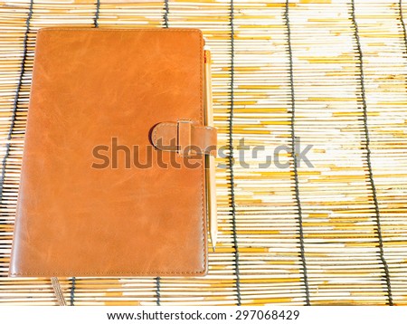 Leather Bound Book on mat wood