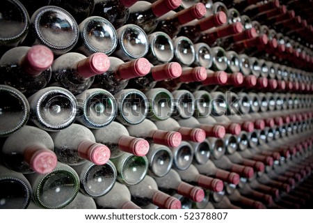 Red wine bottles in a cellar