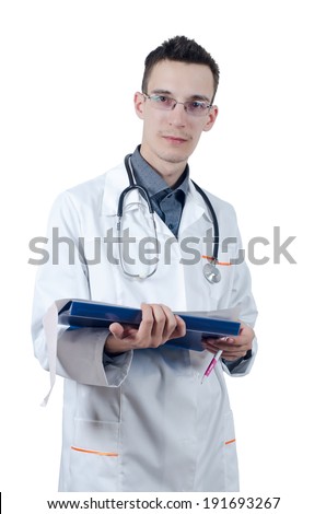 Young male doctor in glasses, standing with a ballpoint pen in hand and ECG. Looking at the camera. Isolated on white