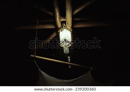 Lamp on the ceiling of the old bungalow at night