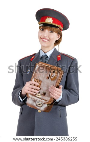 Young girl in a captain\'s uniform Ministry of Internal Affairs of the USSR (Soviet police) with leather tablet in hands. Isolated on white