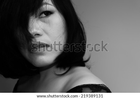 Close up Portrait of beautiful asian woman with hairstyle and makeup monochrome