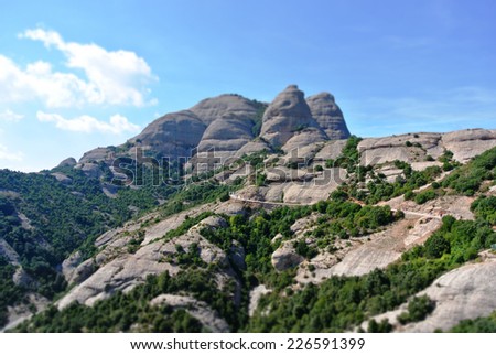 Unusual landscape of the Montserrat mountain in Spain, with tilt shift effect.