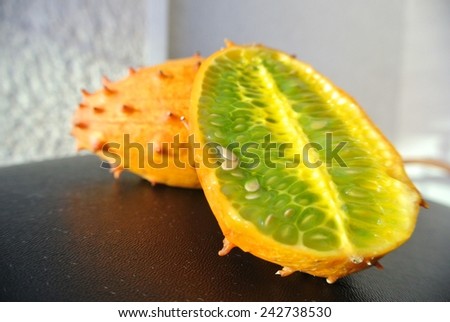 Kiwano fruit, also known as horned melon, African horned cucumber, jelly melon or melano, cut in half.
