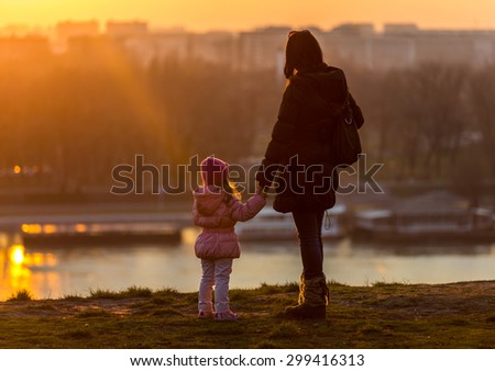 Mother and Daughter walk on a sunny winter day / Mother and Daughter