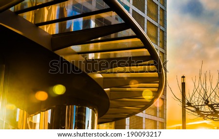 Arch canopy of modern building at colorful sunset