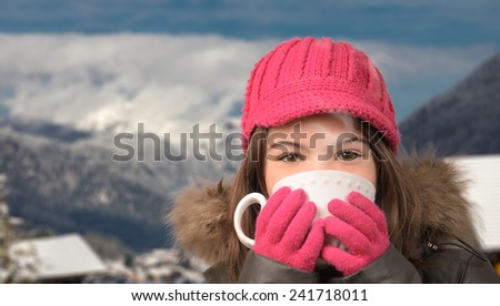 Cute girl with a cup of tea in the snowy mountain village, smoke, vapor, from hot tea with mountain peak in the distance, pretty brown eyes.