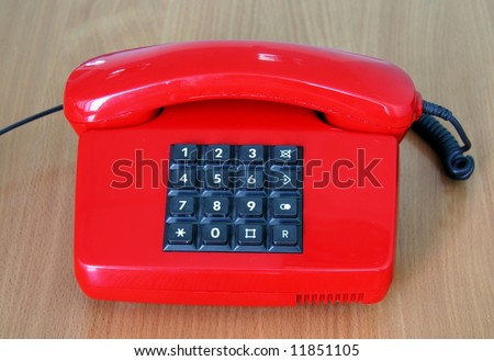 Old style red phone with buton mode for a call