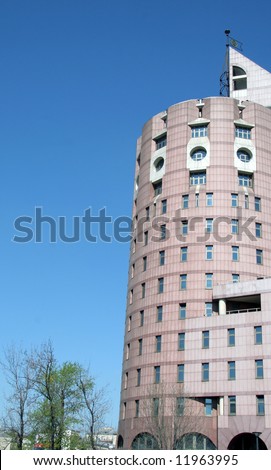 Corporate building in a bright sunny day on a background of the dark blue sky.\
\
See more corporate and residential buildings by keyword \