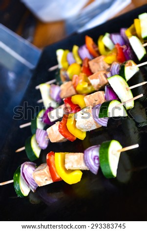 Grilling vegetables and vegan, vegetarian skewers or kebabs with tofu, onions, pumpkins and peppers.