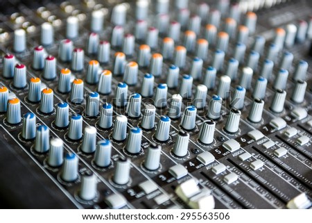 Concert or DJ Music Mixer desk. Sound control panel with knobs and sliders and equalizers