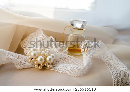 Vintage Perfume Bottle with brooch and lace