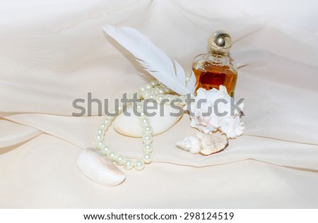 Vintage Perfume Bottle with pearls, shellfish, white sea stone and feather