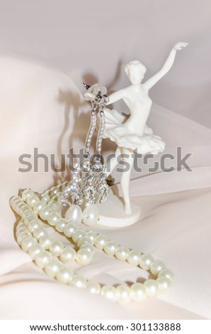 Vintage composition with ballerina, pearls and earrings