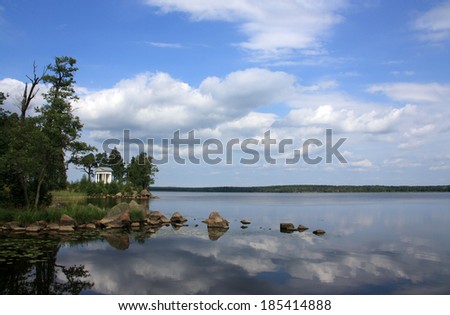 Landscape of lake with island, stones and pavilion