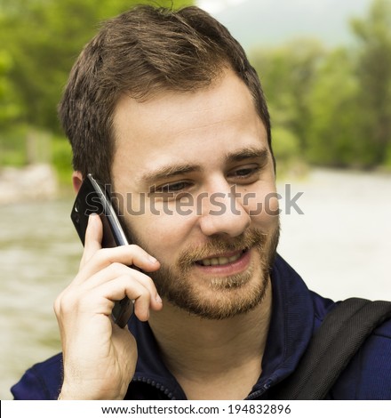Smiling Guy on a cell phone