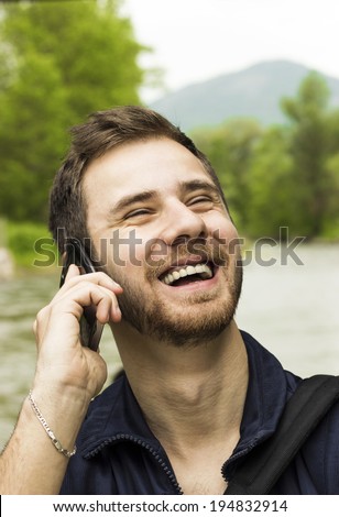 Smiling Guy on a cell phone