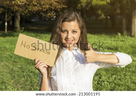 Girl holding paper with inscription no stress. No stress i like concept.