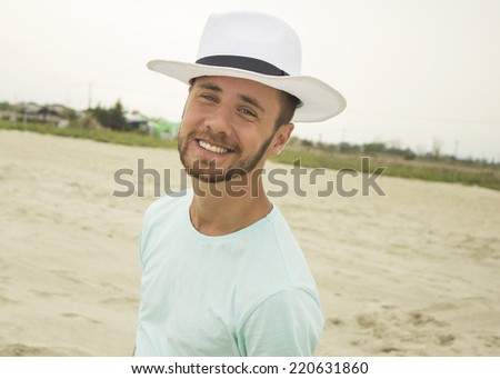 Portrait of man smile on beach summer vacation, Handsome young male wear hat.