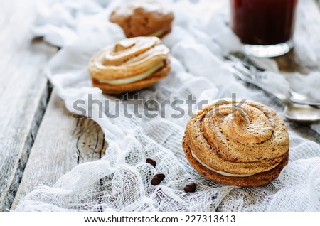 chocolate meringue with cream cheese on a light woody background. tinting. selective focus