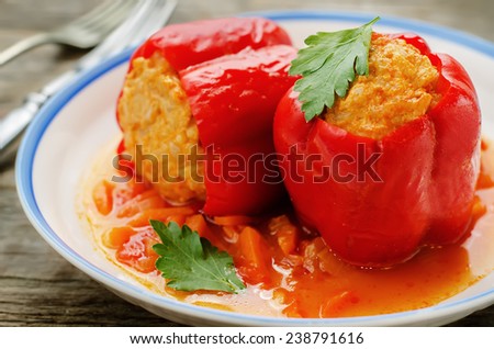 pepper stuffed with meat and rice on a dark wood background. tinting. selective focus