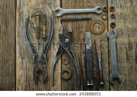 old tools on a dark wood background. tinting. selective focus