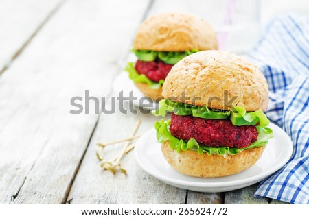 Quinoa, beet and chickpea burgers on a white wood background. tinting. selective focus