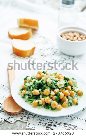 chickpeas and spinach curry on a white background. the toning. selective focus