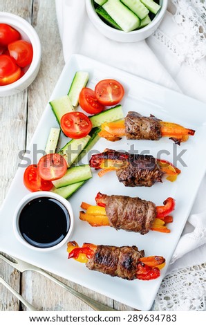 beef stuffed peppers, carrots and onions with balsamic dressing. the toning. selective focus
