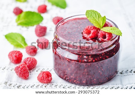 raspberry jam on a white background. the toning. selective focus