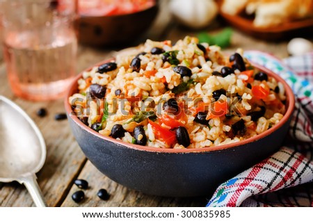 Mexican tomato black beans rice with cilantro. the toning. selective focus