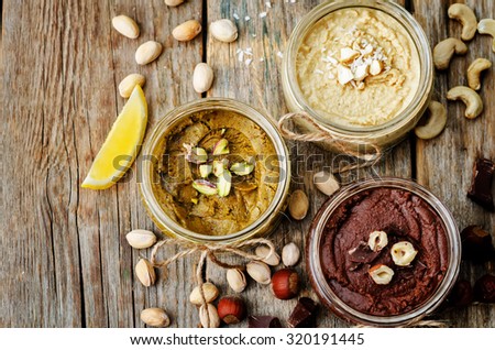 list toasted nut butters, pistachio, hazelnut and cashew. toning. selective focus