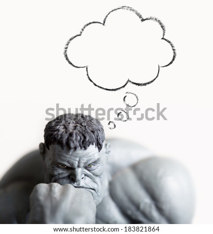Muscular man thinking in thought bubble