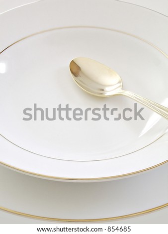 Soup And Cereal Bowl On A Plate With A Spoon