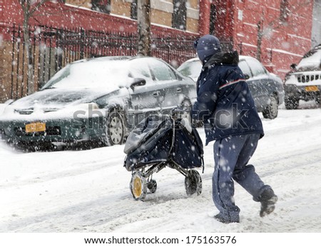 Bronx, New York - January 21: A Mail Man Works While Weathering A 6 To 10 Inch Snow Storm And Teen Temperatures Along Ogden Avenue And 162nd Street. Taken January 21, 2014 In The Bronx, New York.