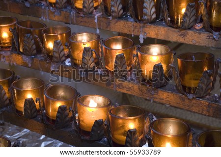 Church candles lit for prayers and offerings