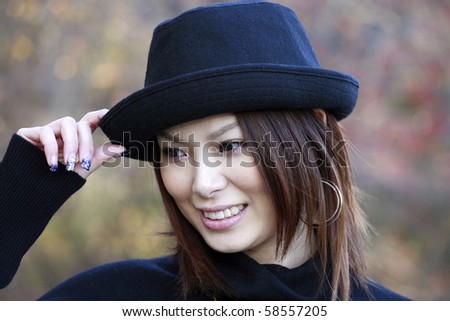 Fashion model poses in Central Park New York.  She was 23 at the time of shoot and of japanese ethnicity.  Photographed November, 2007.